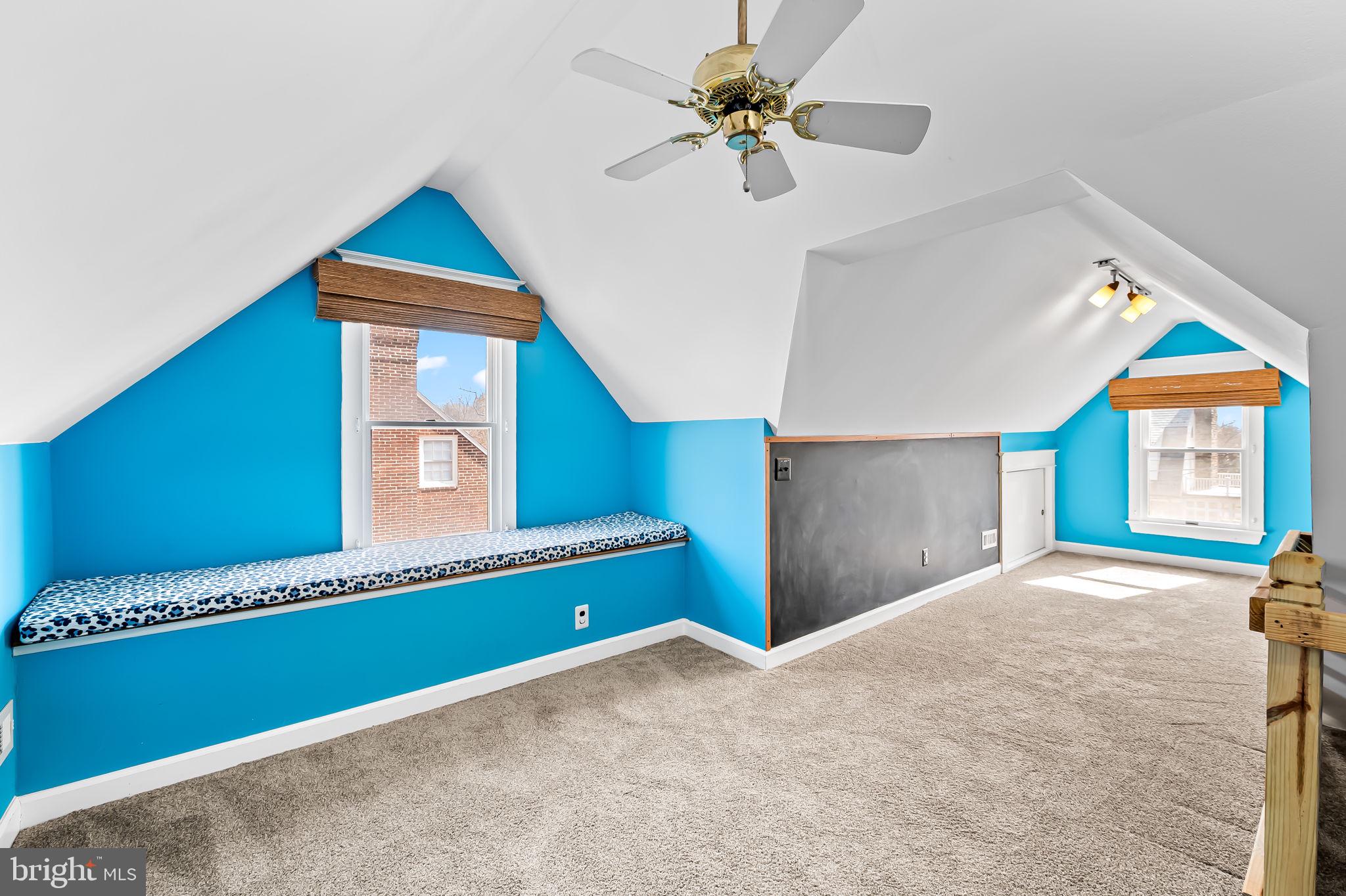 703 Chumleigh Road Baltimore, MD 21212 - Photo 31 of 41 a bedroom with a bed and a chandelier