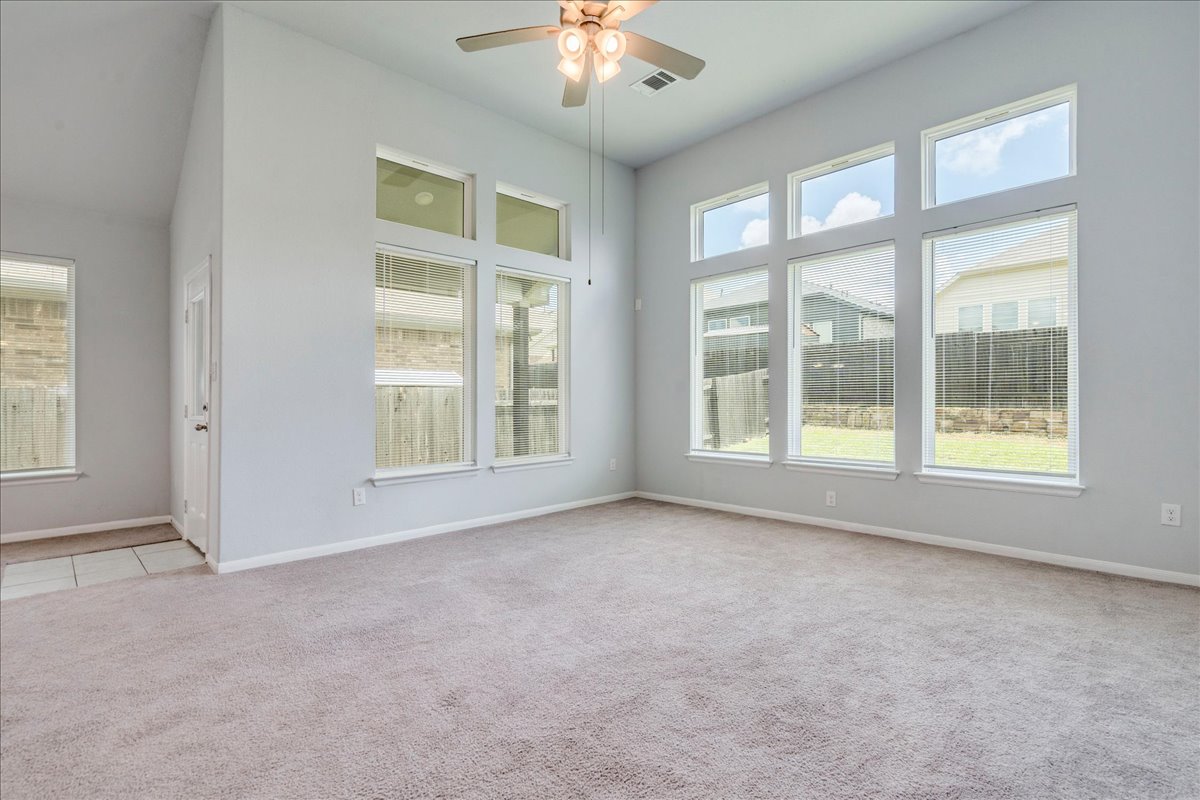 275 Cherrystone Loop Buda, TX 78610 - Photo 14 of 33 Living area with large windows