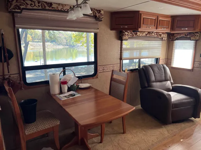 a bathroom with mirror cabinets and toilet