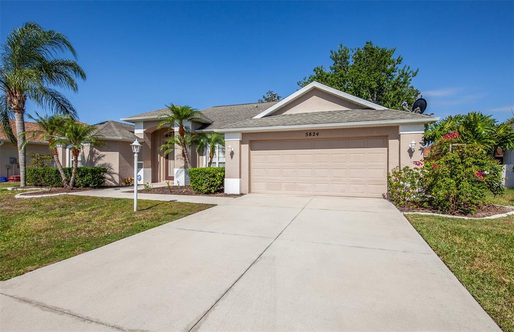5824 McKinley Road Venice, FL 34293 - Photo 1 of 1 a front view of a house with garden