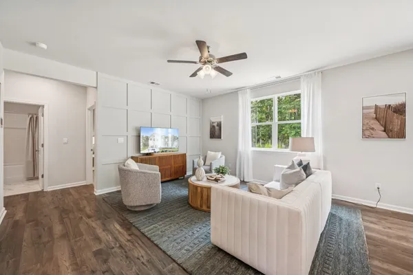 a living room with furniture and a window