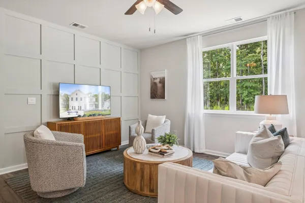 a living room with furniture and a window