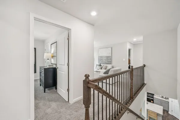 a view of a hallway with a bathroom