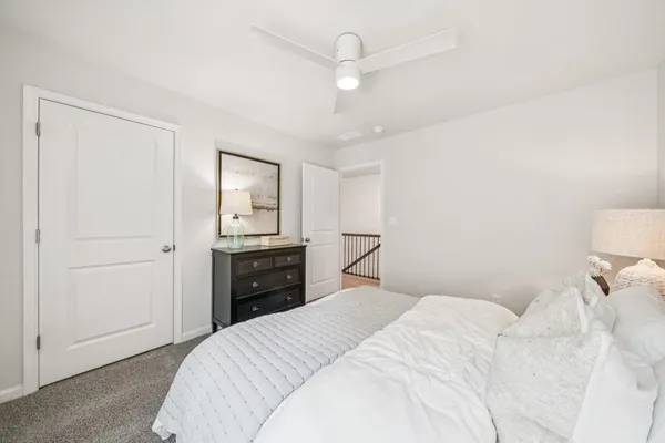 a bedroom with a bed and a closet