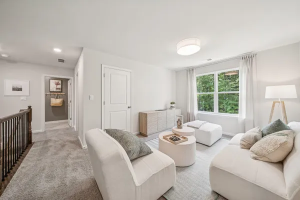 a bedroom with furniture and a window