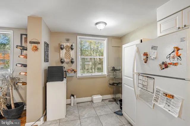 a view of a livingroom with furniture and a window