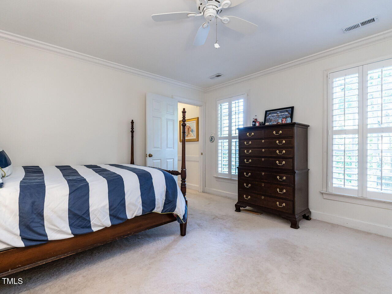 2100 Fallon Oaks Court Raleigh, NC 27608 - Photo 14 of 20 a spacious bedroom with a bed and a window
