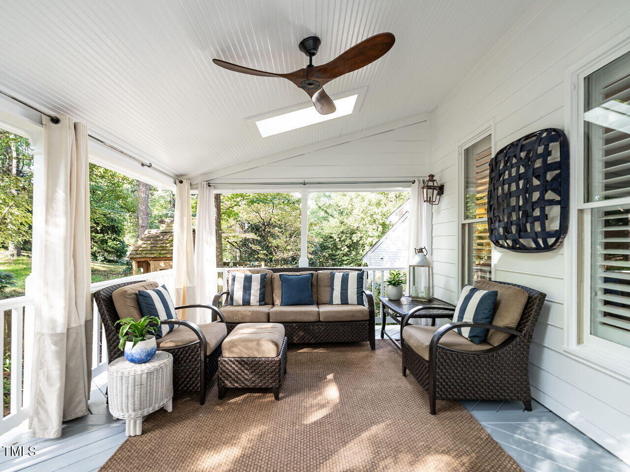 2100 Fallon Oaks Court Raleigh, NC 27608 - Photo 17 of 20 a living room with furniture and a large window