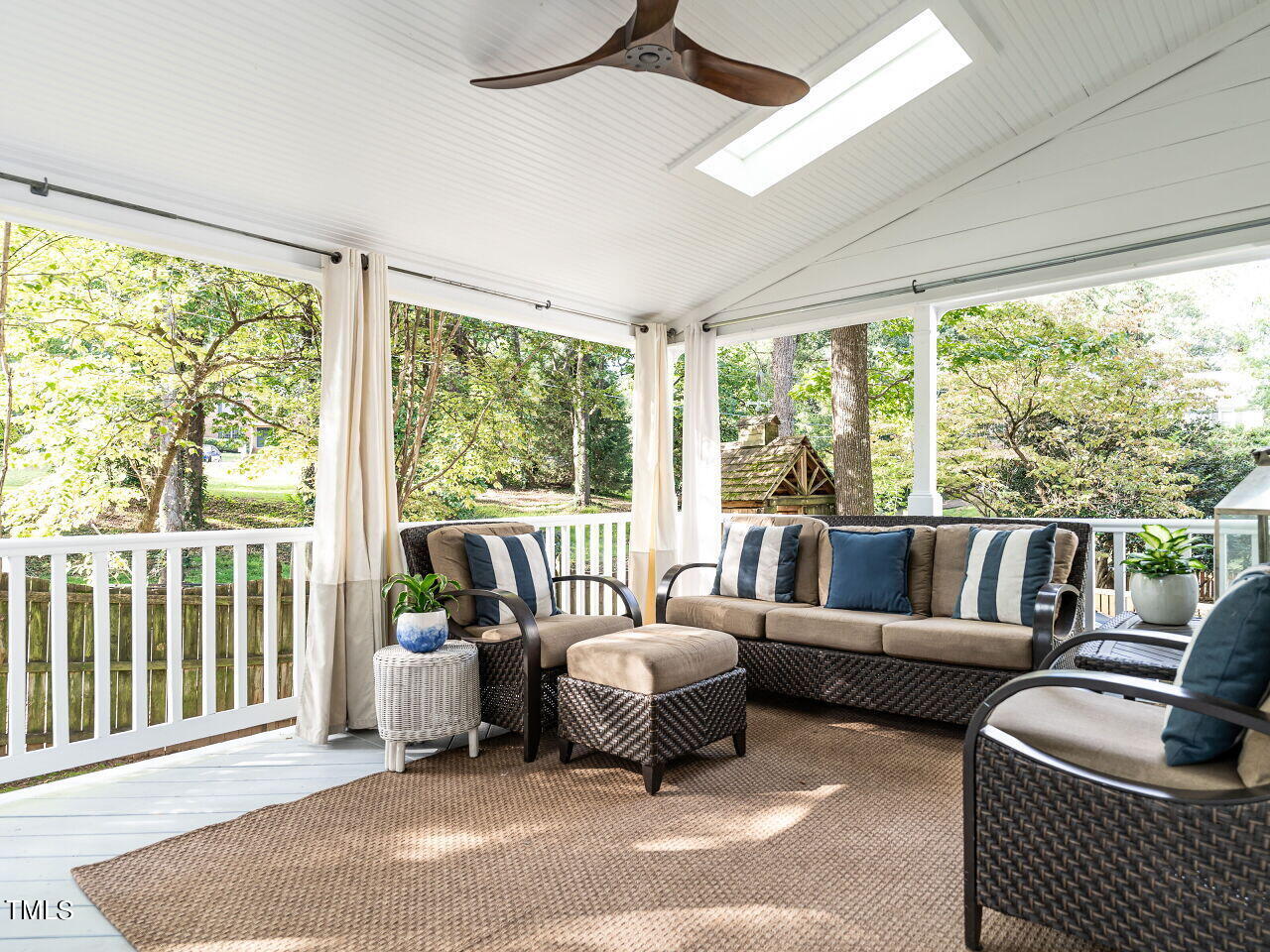 2100 Fallon Oaks Court Raleigh, NC 27608 - Photo 18 of 20 a living room with furniture and a large window