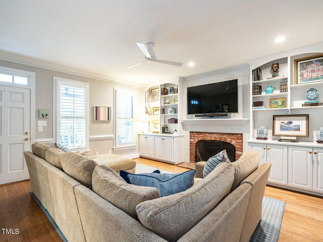 2100 Fallon Oaks Court Raleigh, NC 27608 - Photo 8 of 20 a living room with furniture fireplace and flat screen tv