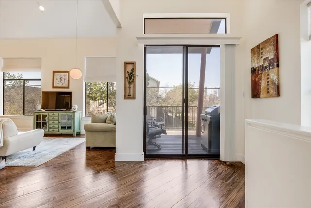 a view of a livingroom with furniture and a flat screen tv