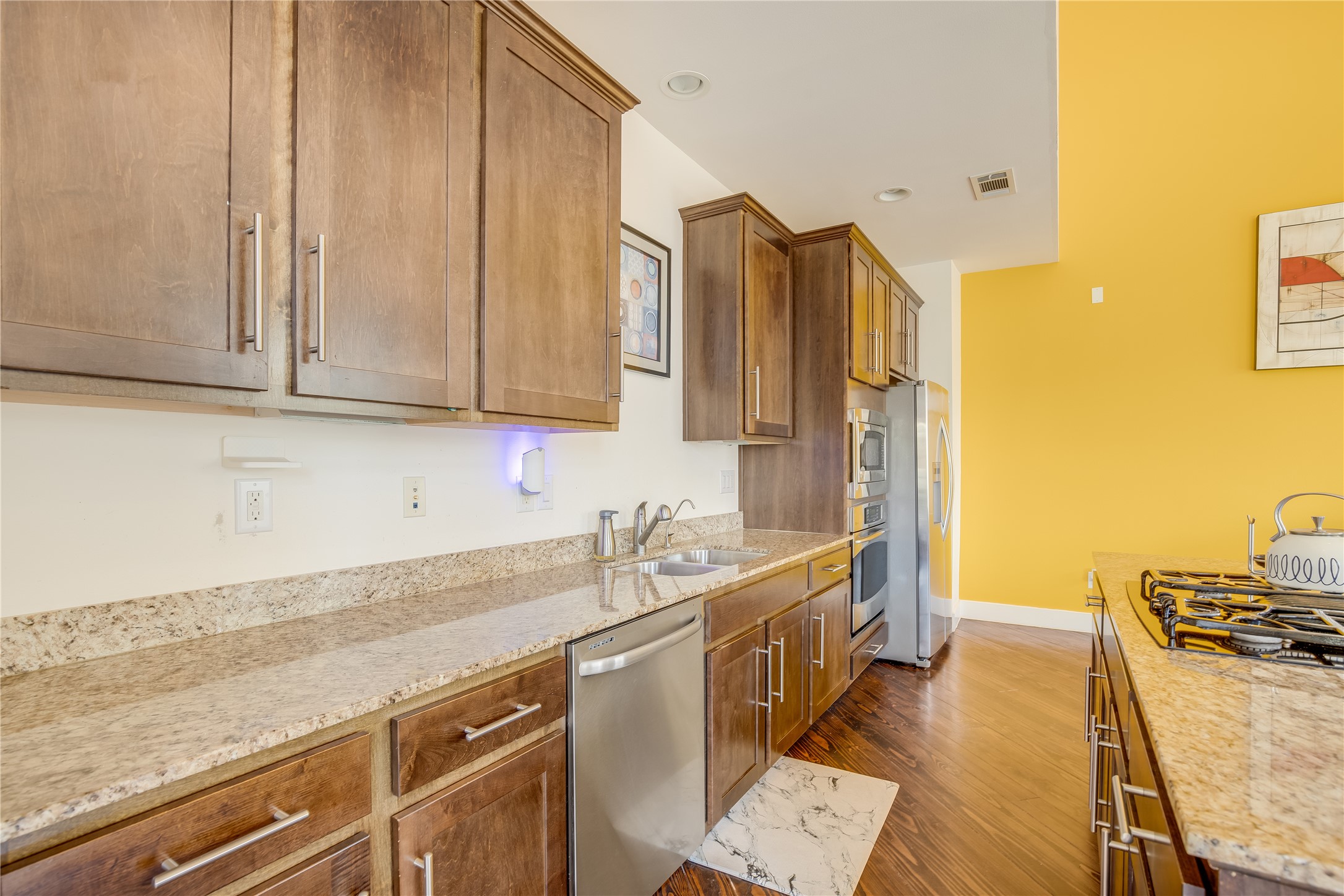 2205 Bastrop Street Houston, TX 77003 - Photo 13 of 31 a kitchen with stainless steel appliances granite countertop a sink and cabinets