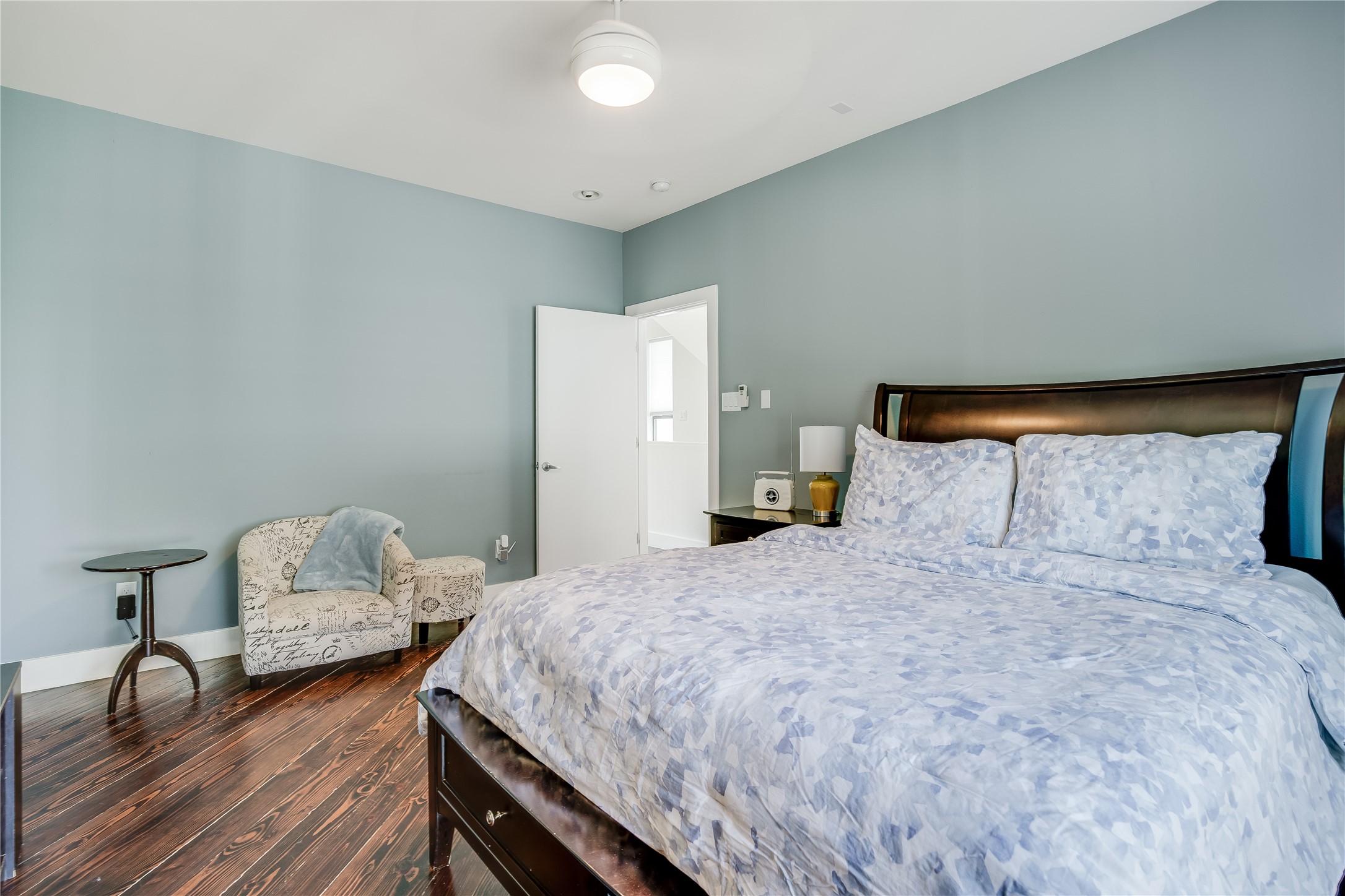 2205 Bastrop Street Houston, TX 77003 - Photo 17 of 31 a bedroom with a bed and wooden floor