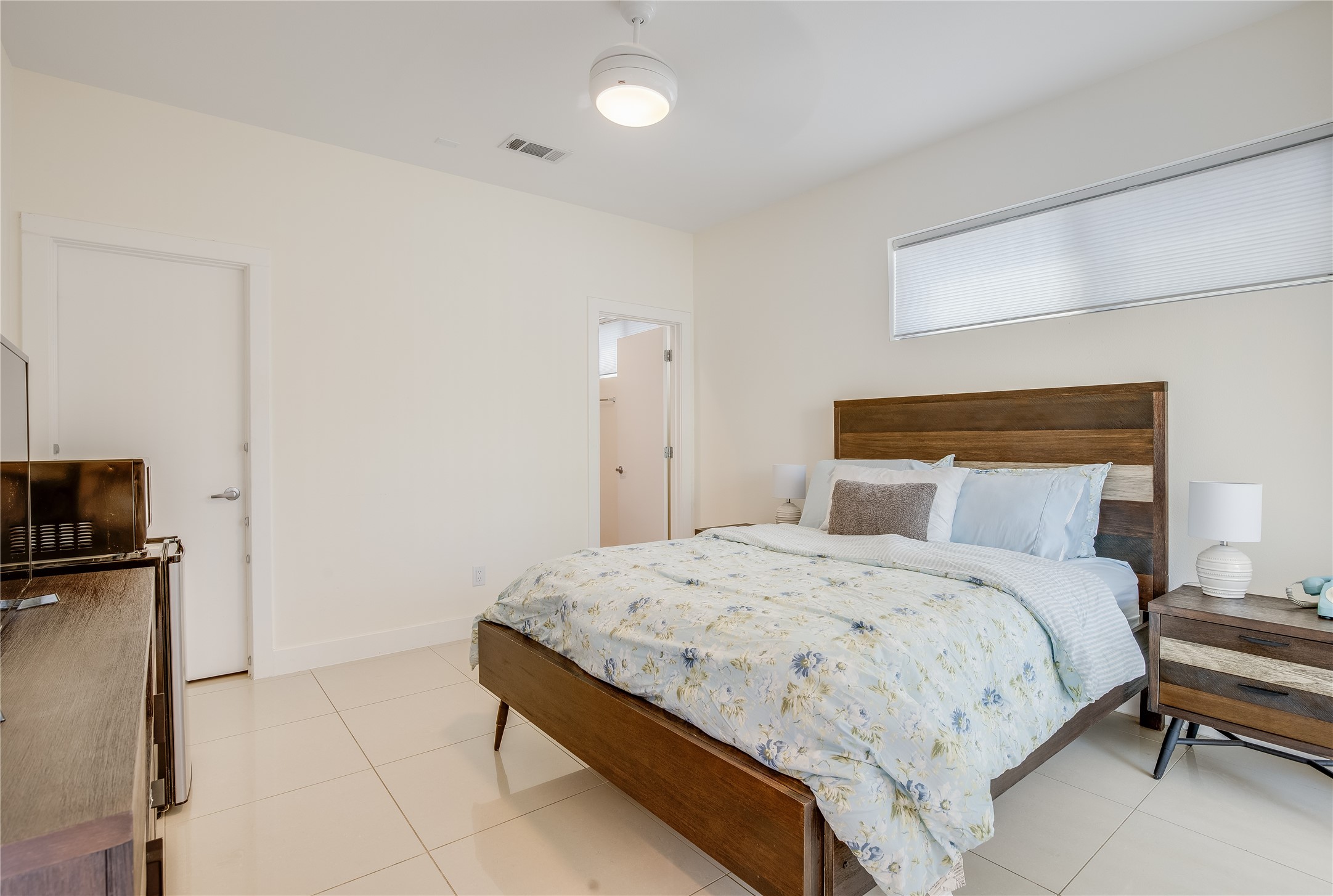 2205 Bastrop Street Houston, TX 77003 - Photo 20 of 31 a bedroom with a bed and a flat screen tv