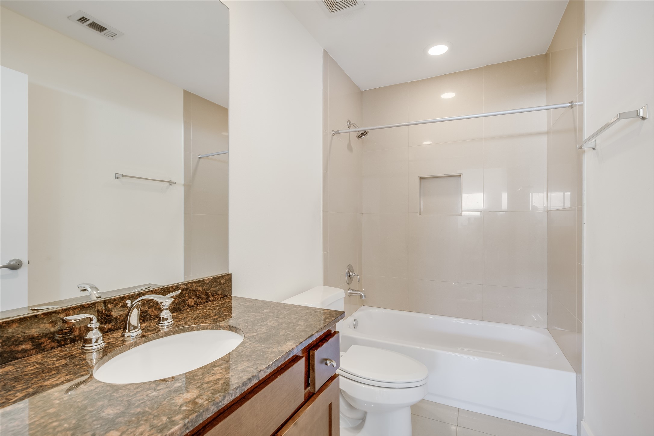 2205 Bastrop Street Houston, TX 77003 - Photo 26 of 31 a bathroom with a granite countertop sink toilet and shower