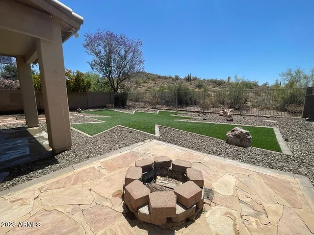a view of a backyard with large trees