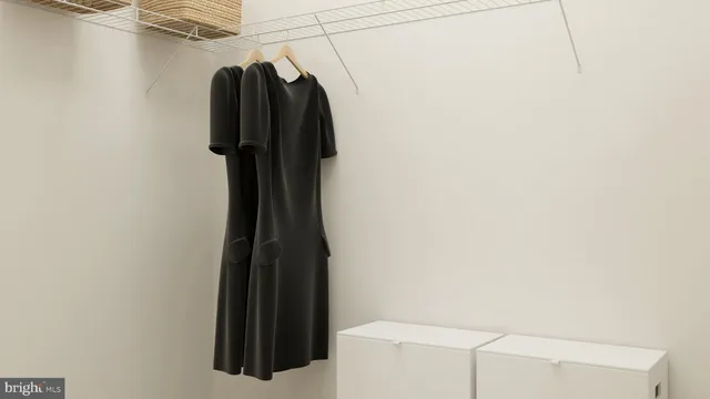 a bathroom with a toilet and a mirror