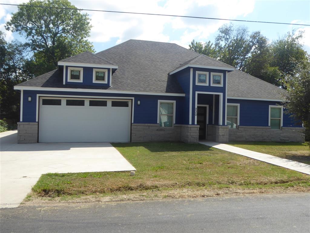 230 Third Street Wilmer, TX 75172 - Photo 2 of 40 a front view of a house with a yard