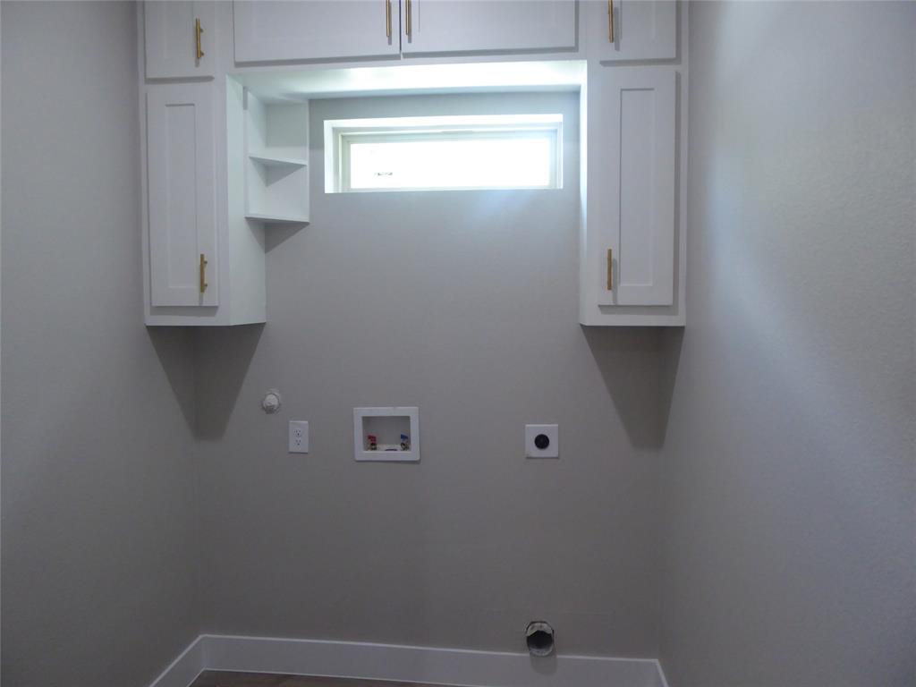 230 Third Street Wilmer, TX 75172 - Photo 22 of 40 a view of small space with wooden floor and cabinets