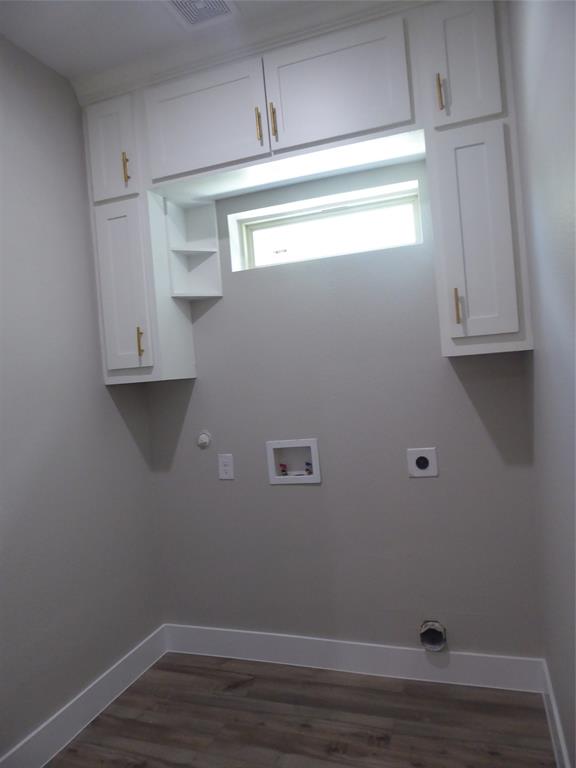 230 Third Street Wilmer, TX 75172 - Photo 23 of 40 a view of a small space with wooden floor and cabinets