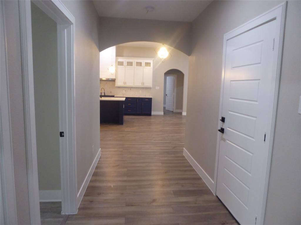 230 Third Street Wilmer, TX 75172 - Photo 24 of 40 a view of a hallway view with wooden floor and staircase