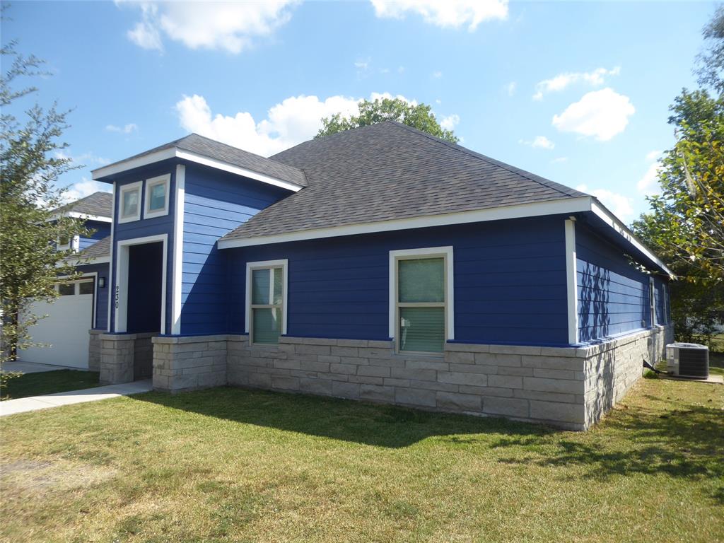 230 Third Street Wilmer, TX 75172 - Photo 3 of 40 a view of a house with a yard