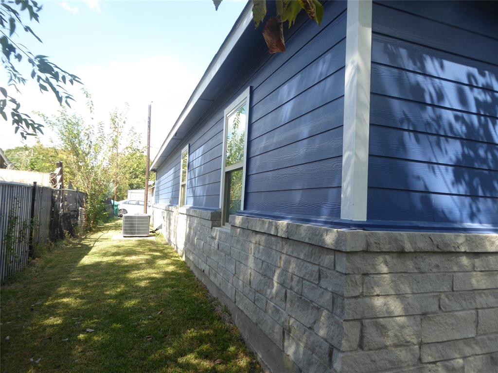 230 Third Street Wilmer, TX 75172 - Photo 31 of 40 a view of a backyard with a tree