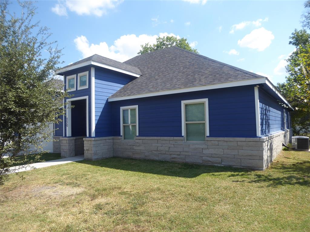 230 Third Street Wilmer, TX 75172 - Photo 32 of 40 a front view of a house with a yard