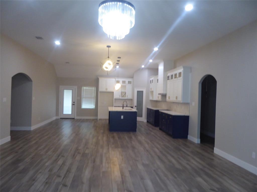 230 Third Street Wilmer, TX 75172 - Photo 33 of 40 a large room with lots of counter space and painting on the wall