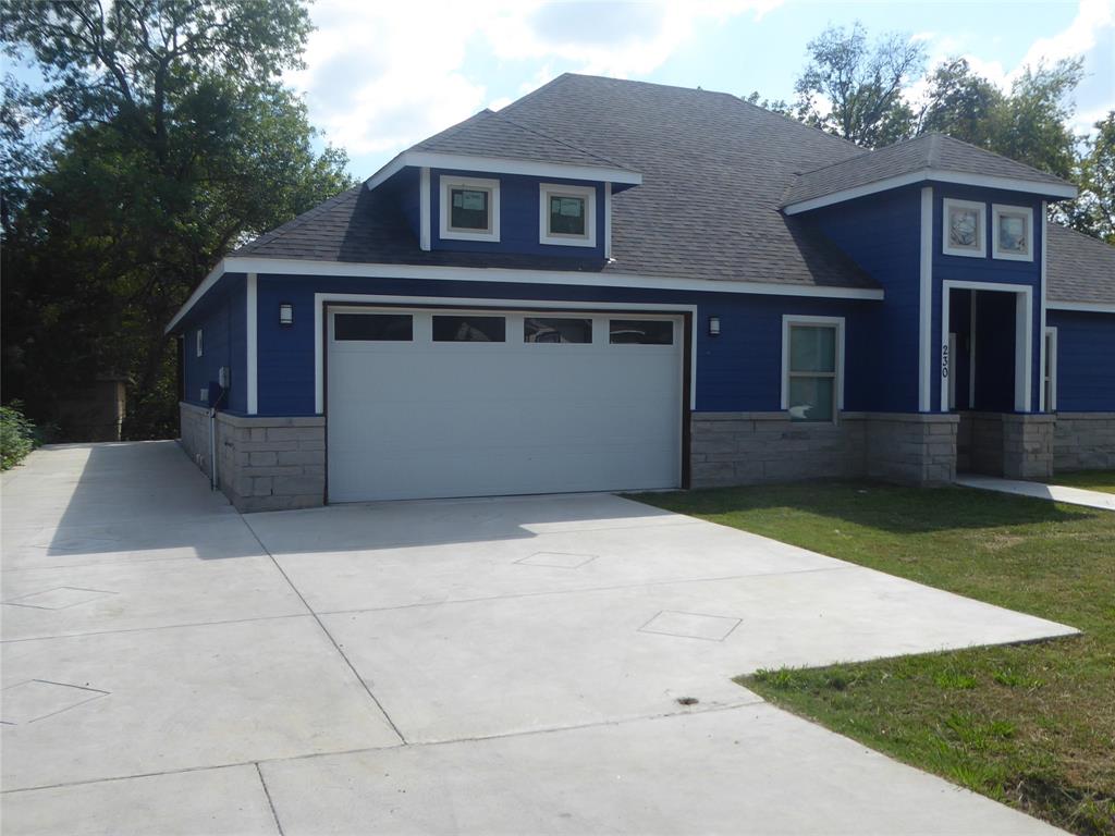 230 Third Street Wilmer, TX 75172 - Photo 36 of 40 a front view of a house with a yard