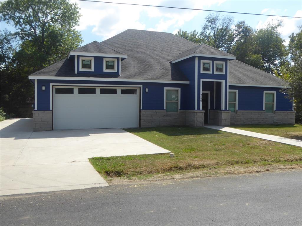 230 Third Street Wilmer, TX 75172 - Photo 37 of 40 front view of a house with a yard
