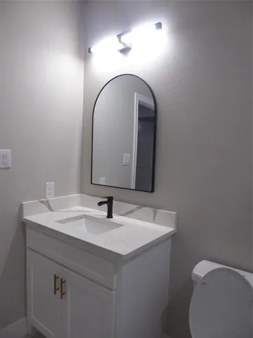 a bathroom with a sink and a toilet