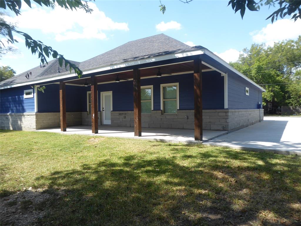 230 Third Street Wilmer, TX 75172 - Photo 4 of 40 a house with yard in front of it