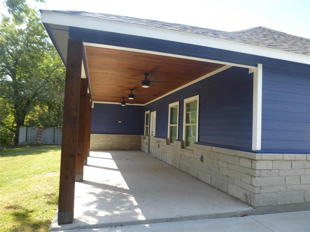 230 Third Street Wilmer, TX 75172 - Photo 5 of 40 a view of house with yard