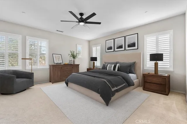 a spacious bedroom with a bed and window