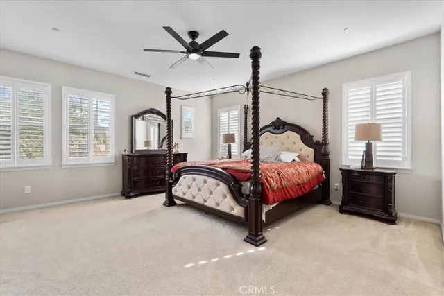 a bedroom with a bed dresser and a window