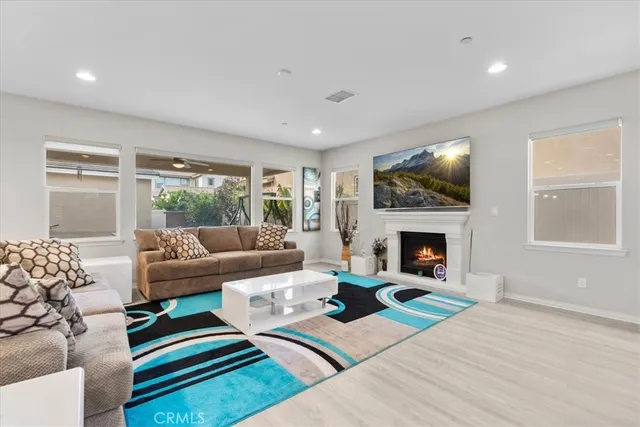 a living room with furniture and a fireplace