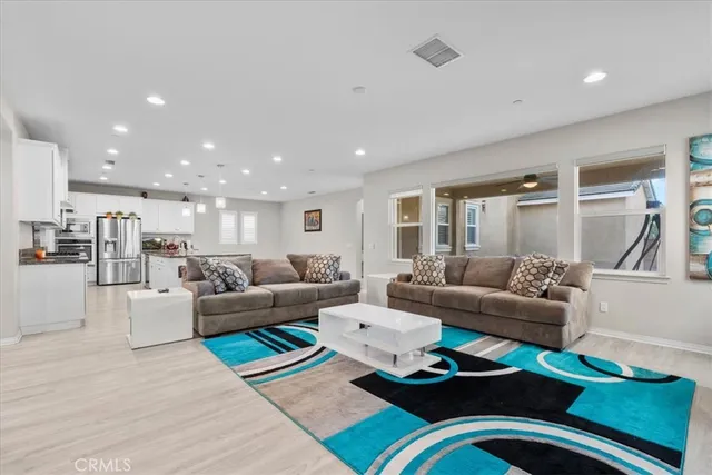 a living room with furniture and a table