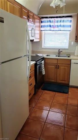 a kitchen with stainless steel appliances a refrigerator and a stove