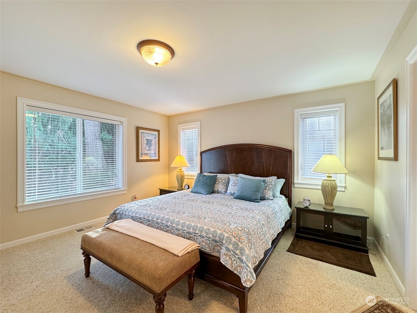 359 Dungeness Meadows Sequim, WA 98382 - Photo 12 of 37 a bedroom with a bed and a lamp with window