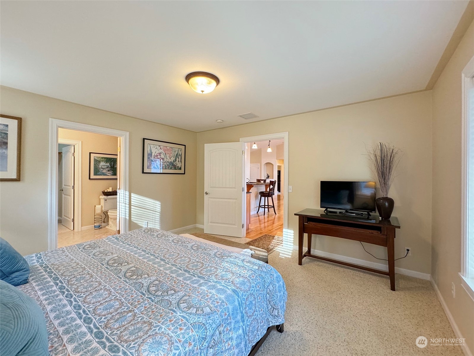 359 Dungeness Meadows Sequim, WA 98382 - Photo 13 of 37 a bedroom with a bed and a flat screen tv