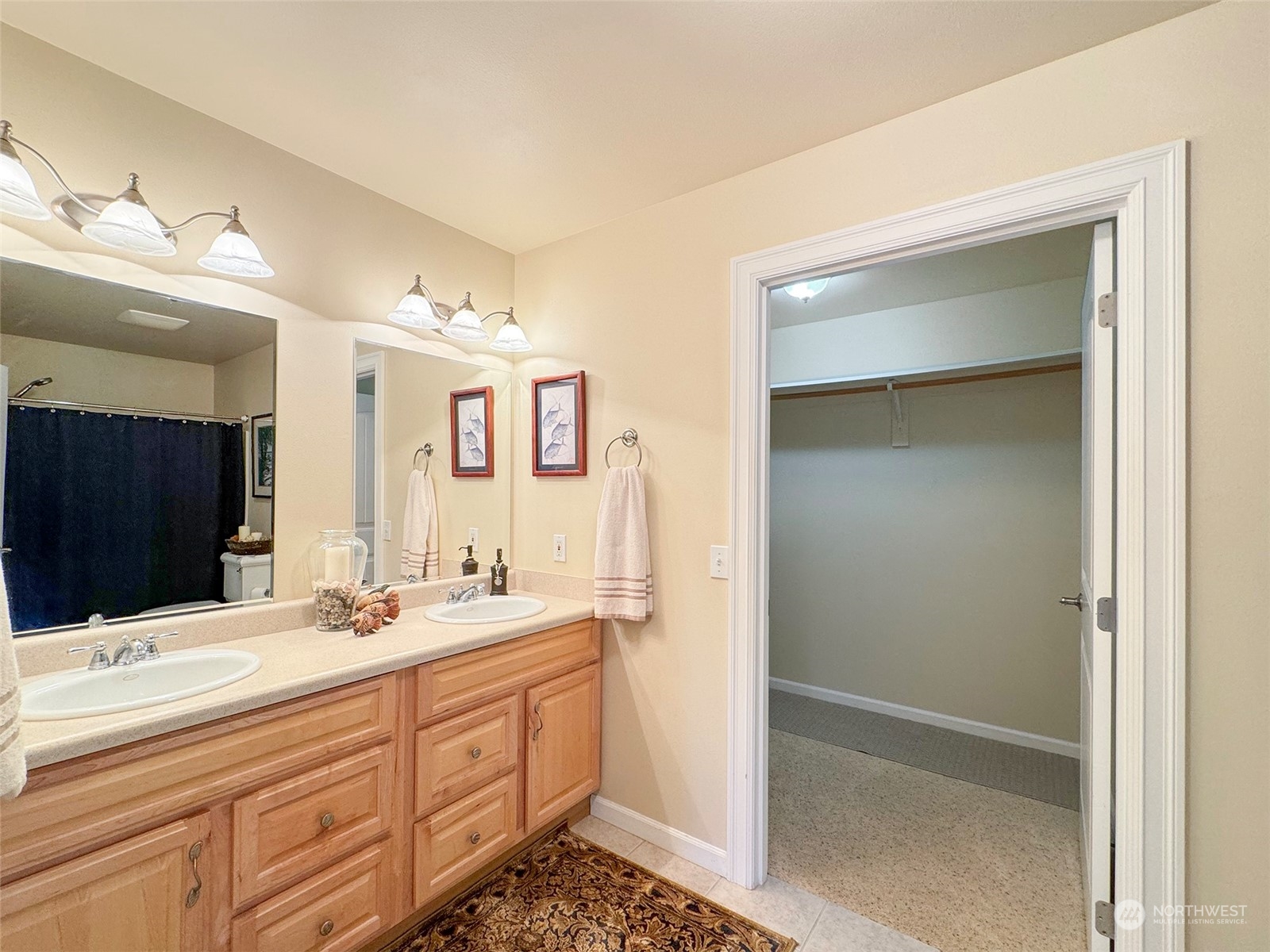 359 Dungeness Meadows Sequim, WA 98382 - Photo 14 of 37 a bathroom with a double vanity sink a mirror and a shower