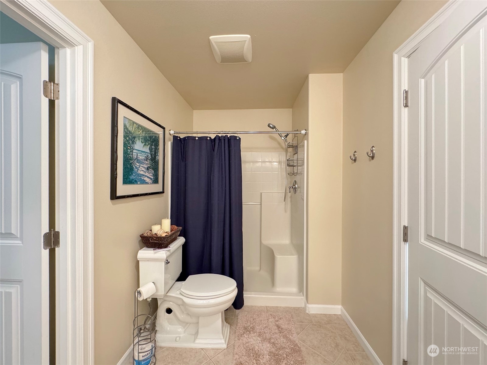 359 Dungeness Meadows Sequim, WA 98382 - Photo 16 of 37 a bathroom with a toilet a sink and a large mirror