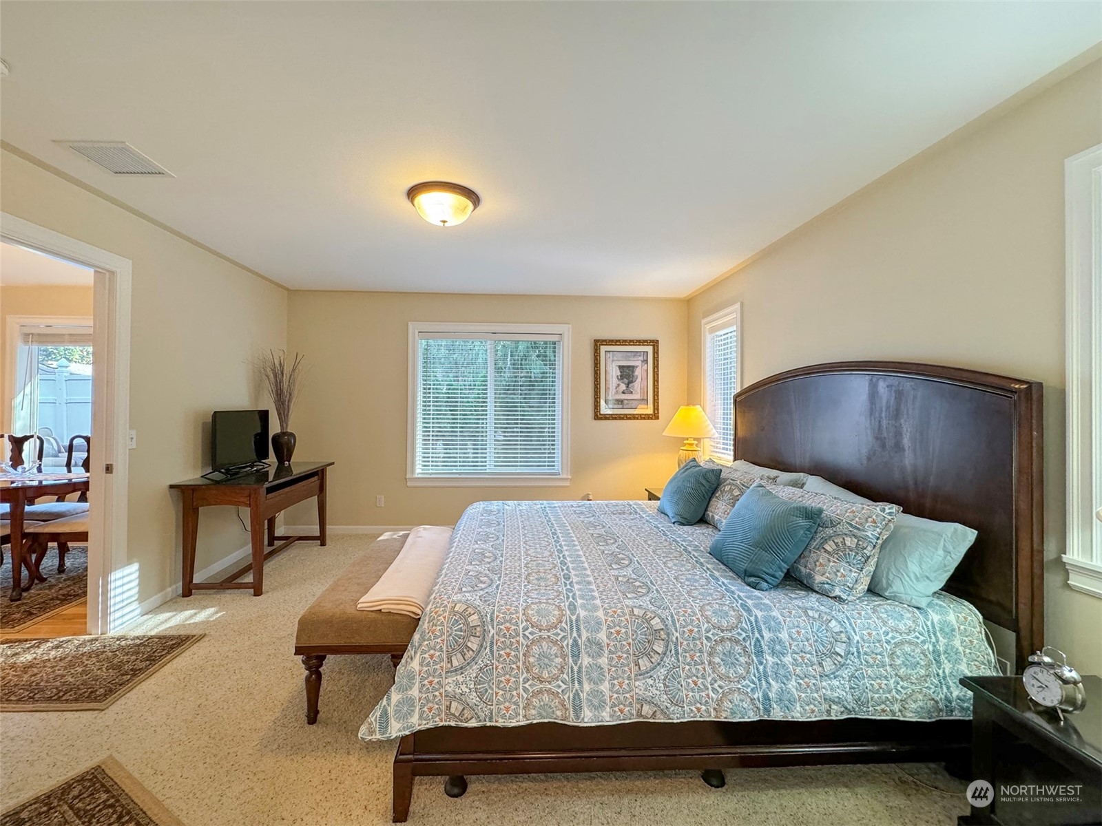 359 Dungeness Meadows Sequim, WA 98382 - Photo 17 of 37 a bedroom with a bed and wooden floor