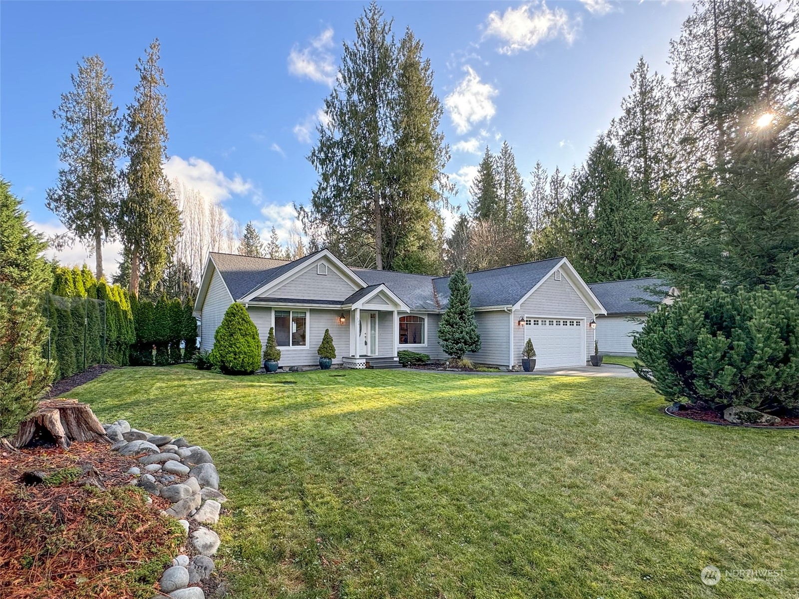 359 Dungeness Meadows Sequim, WA 98382 - Photo 2 of 37 a view of a house with a big yard and large trees