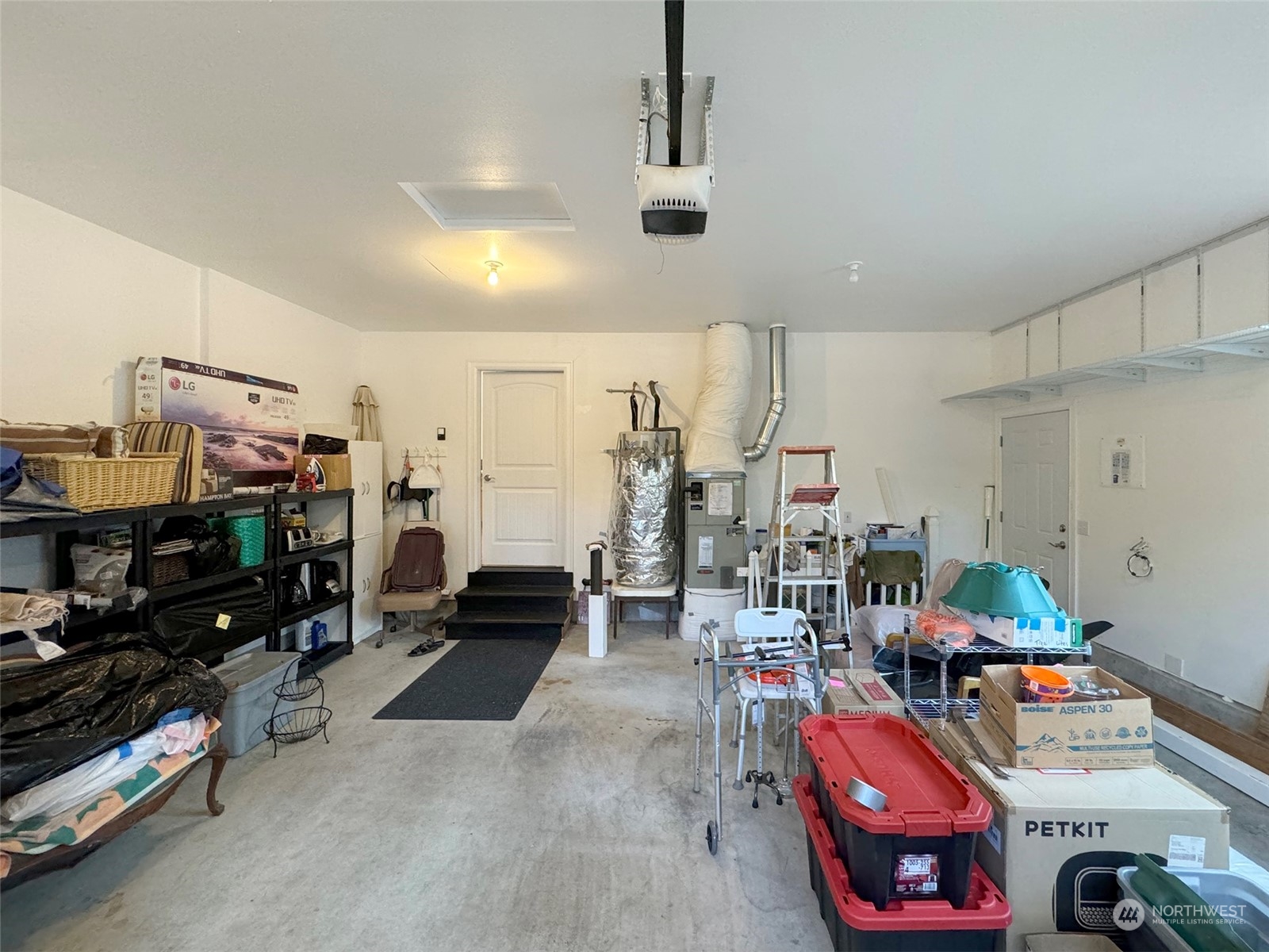 359 Dungeness Meadows Sequim, WA 98382 - Photo 29 of 37 a garage with lots of furniture and clutter