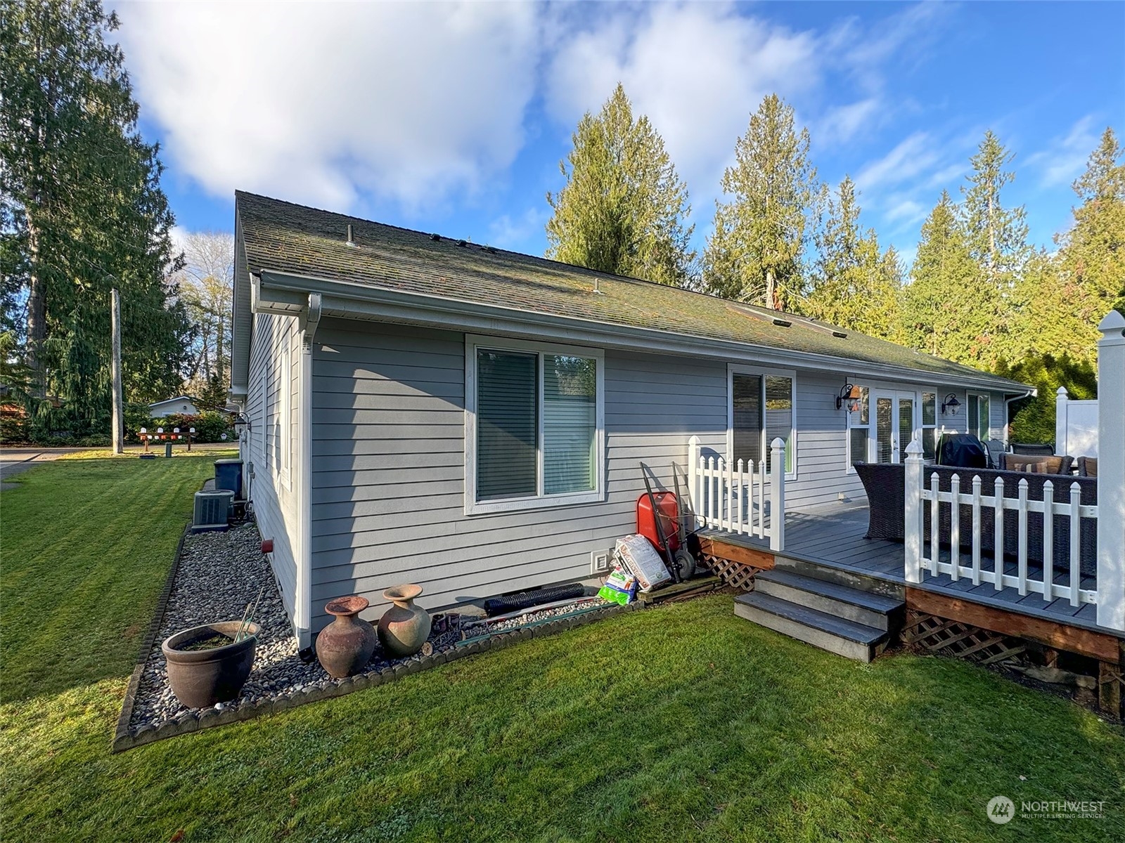 359 Dungeness Meadows Sequim, WA 98382 - Photo 31 of 37 a view of a house with a yard and furniture