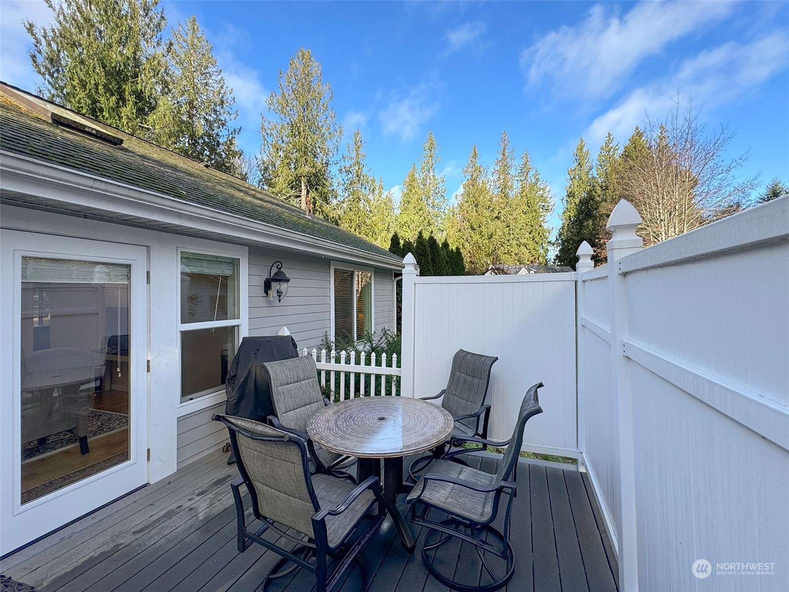 359 Dungeness Meadows Sequim, WA 98382 - Photo 33 of 37 a view of a patio with table and chairs and wooden floor