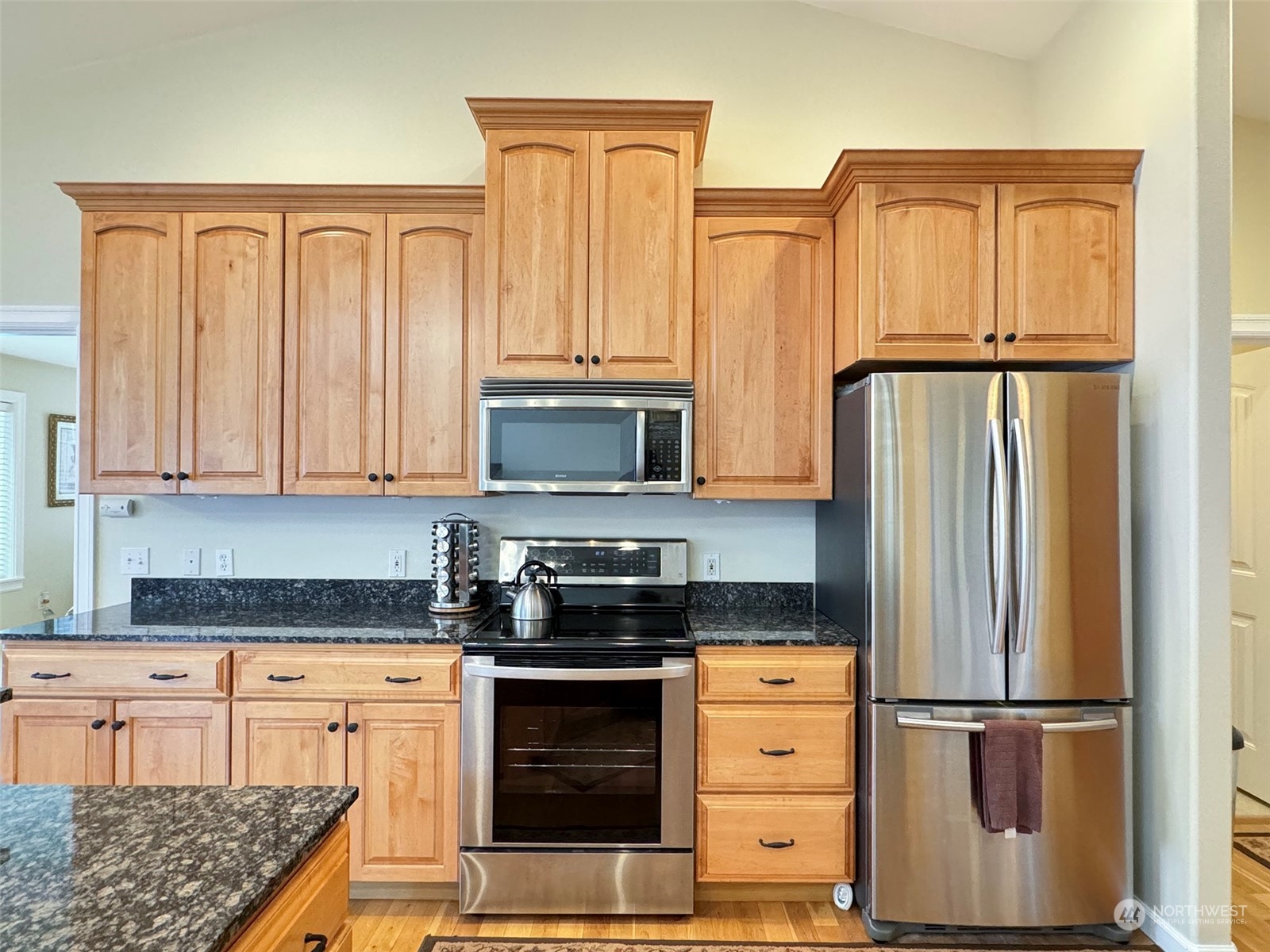 359 Dungeness Meadows Sequim, WA 98382 - Photo 9 of 37 a kitchen with stainless steel appliances granite countertop a refrigerator stove and cabinets
