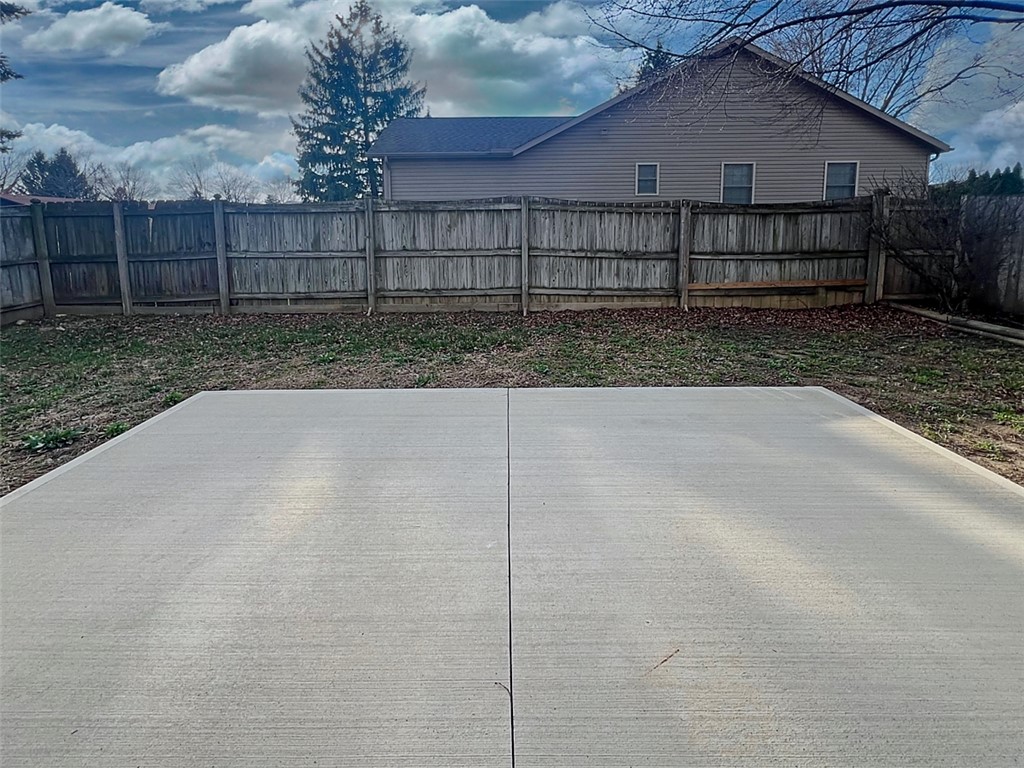 920 North Dorset Road, Unit 920 Troy, OH 45373 - Photo 14 of 18 This spacious backyard features a durable concrete patio, ideal for outdoor gatherings and entertaining.